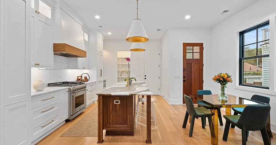 Kitchen with a angled style wood range hood