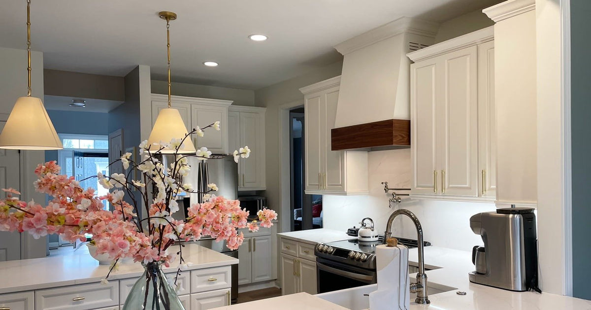 Kitchen with a angled style wood range hood