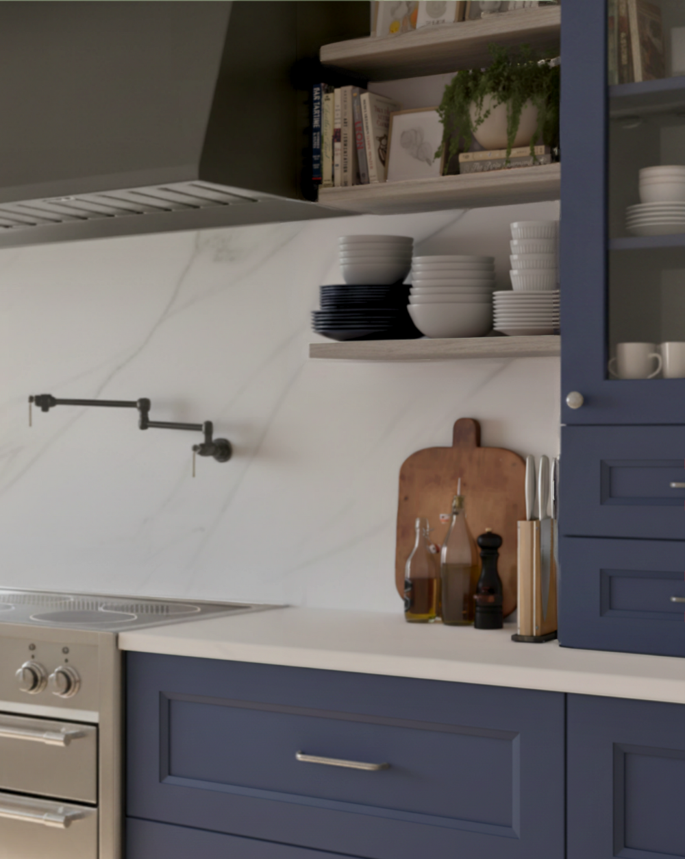 Modern kitchen with blue cabinets, white countertops, and various kitchen items.