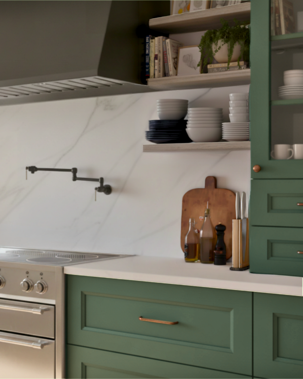 Modern kitchen with green cabinets, white countertop, and marble backsplash.