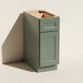 Angled view of a green 12w Belmont beveled Shaker standard base cabinet with 1 door and 1 functional drawer.