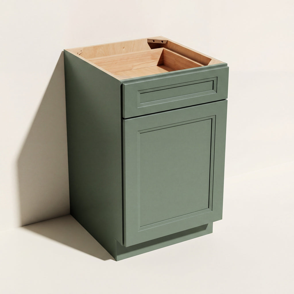 Angled view of a green Belmont 18 inch wide Shaker base cabinet with one door and one top drawer.