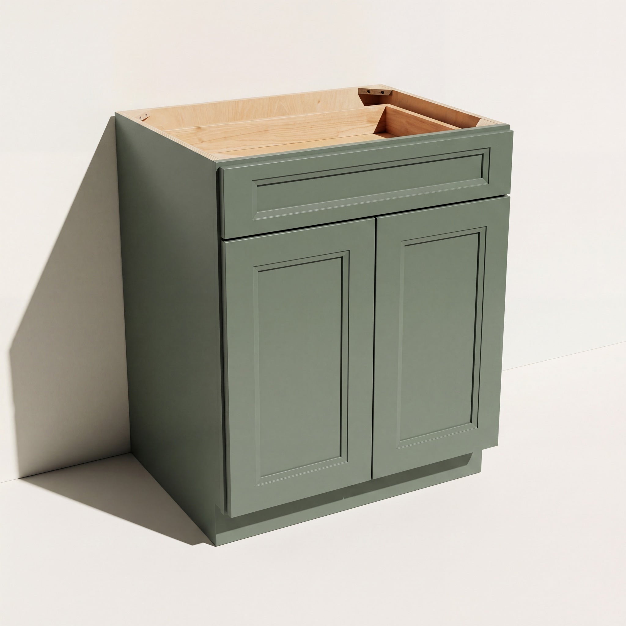 Angled view of a green 24w Belmont Shaker double door base cabinet with 2 doors and 1 functional drawer.