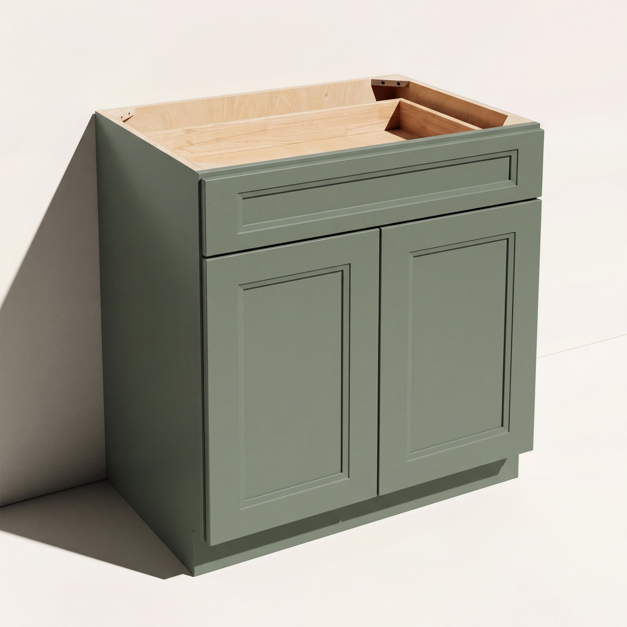 Angled view of a green 30w Belmont beveled Shaker standard base cabinet with 2 doors and 1 functional drawer.