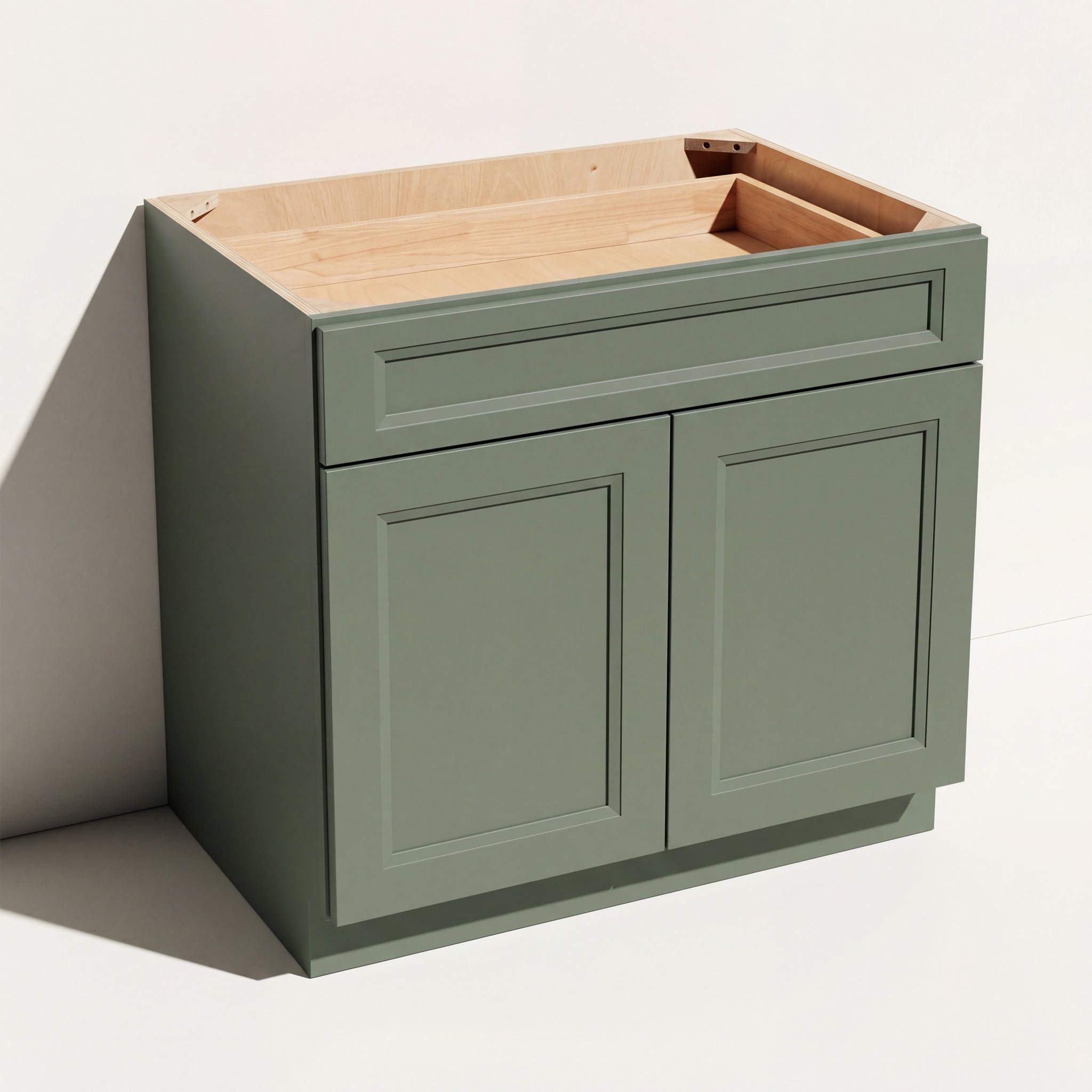 Angled view of a green 36w Belmont beveled Shaker standard base cabinet with 2 doors and 1 functional drawer.