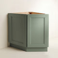 Angled view of a green Belmont beveled Shaker diagonal corner base cabinet with 2 doors.