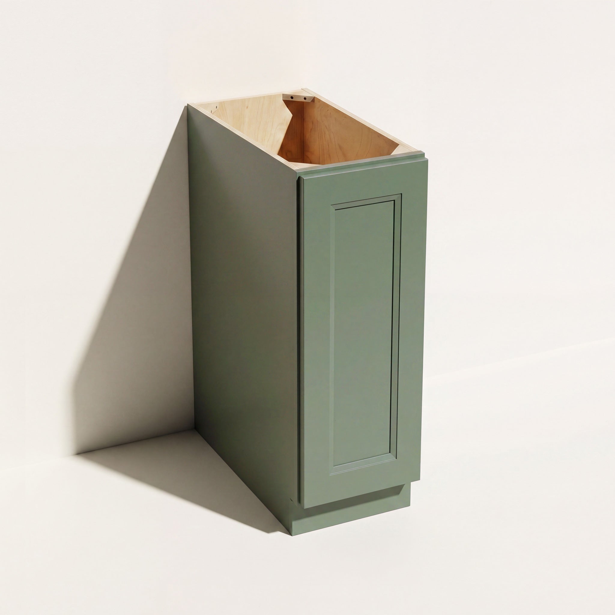 Angled view of a green Belmont beveled Shaker full height base cabinet with 1 door and no drawers.