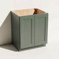 Angled view of a green Belmont Shaker angled base cabinet with two full-height doors.