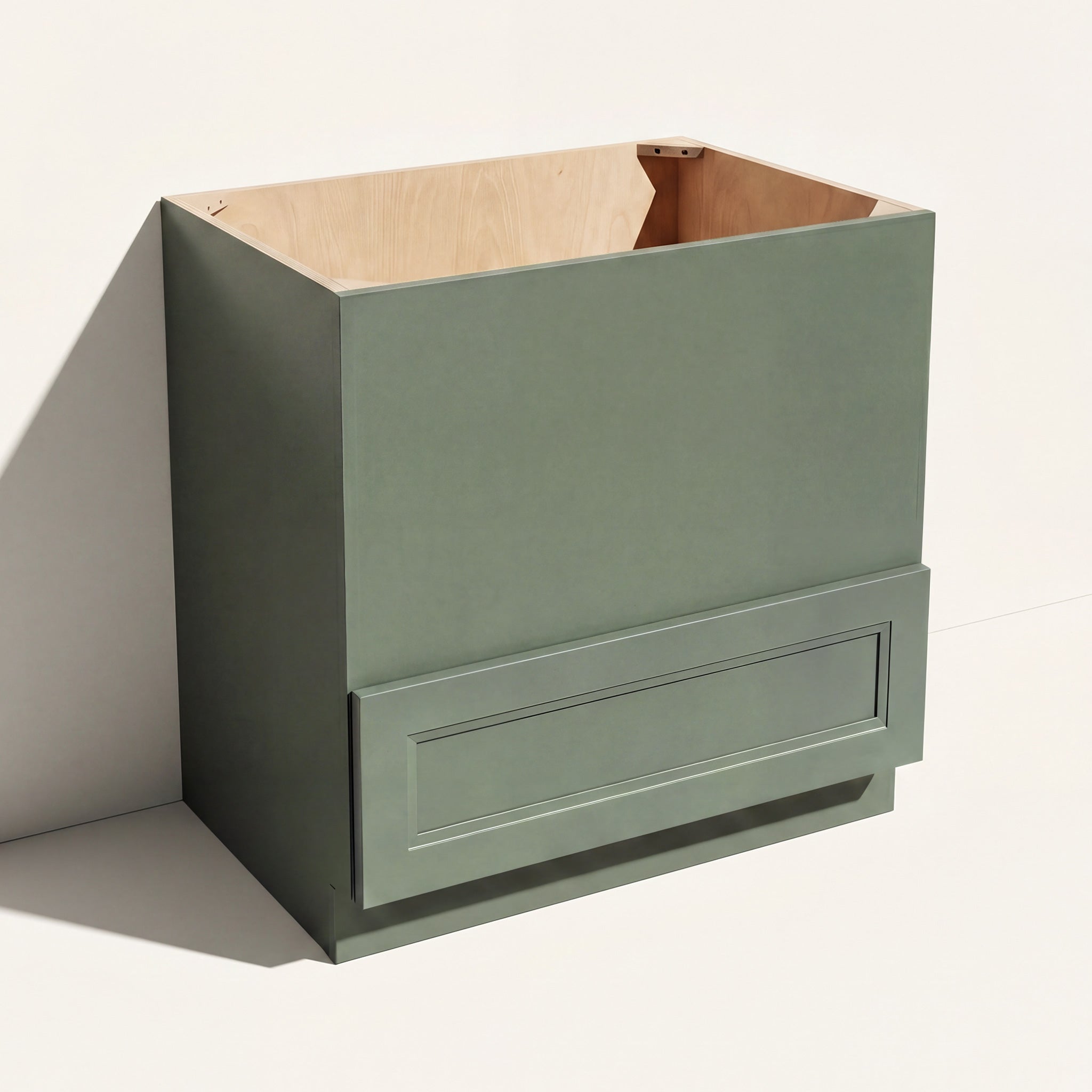 Angled view of a green Belmont beveled Shaker microwave base cabinet with 1 drawer and panel to be cut to fit microwave.