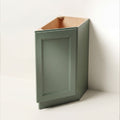 Angled view of a green Belmont beveled Shaker tray divider base cabinet with 1 door.