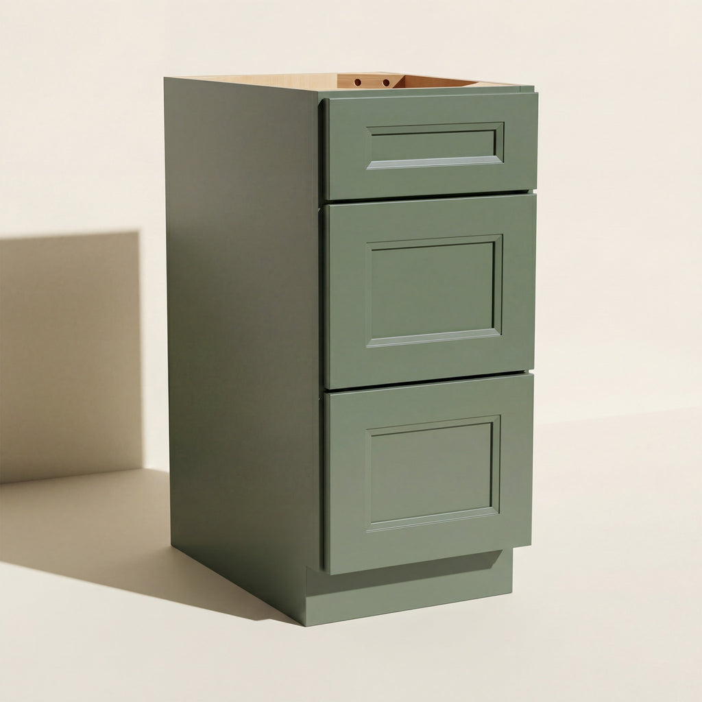 Angled view of a green Belmont beveled Shaker 3-drawer base cabinet.