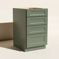 Angled view of a green 18w Belmont Shaker 4-drawer base cabinet with 4 functional drawers.