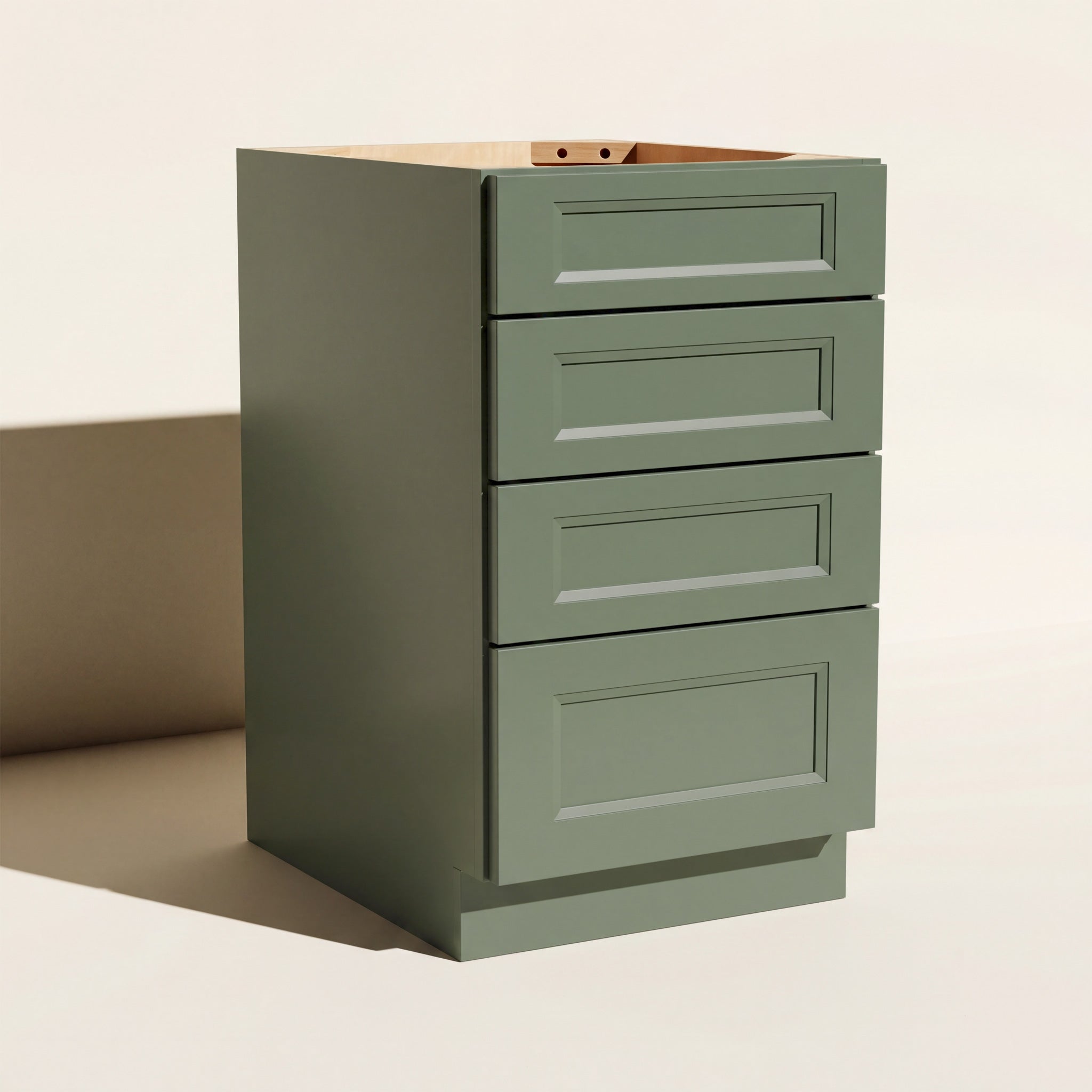 Angled view of a green 18w Belmont Shaker 4-drawer base cabinet with 4 functional drawers.