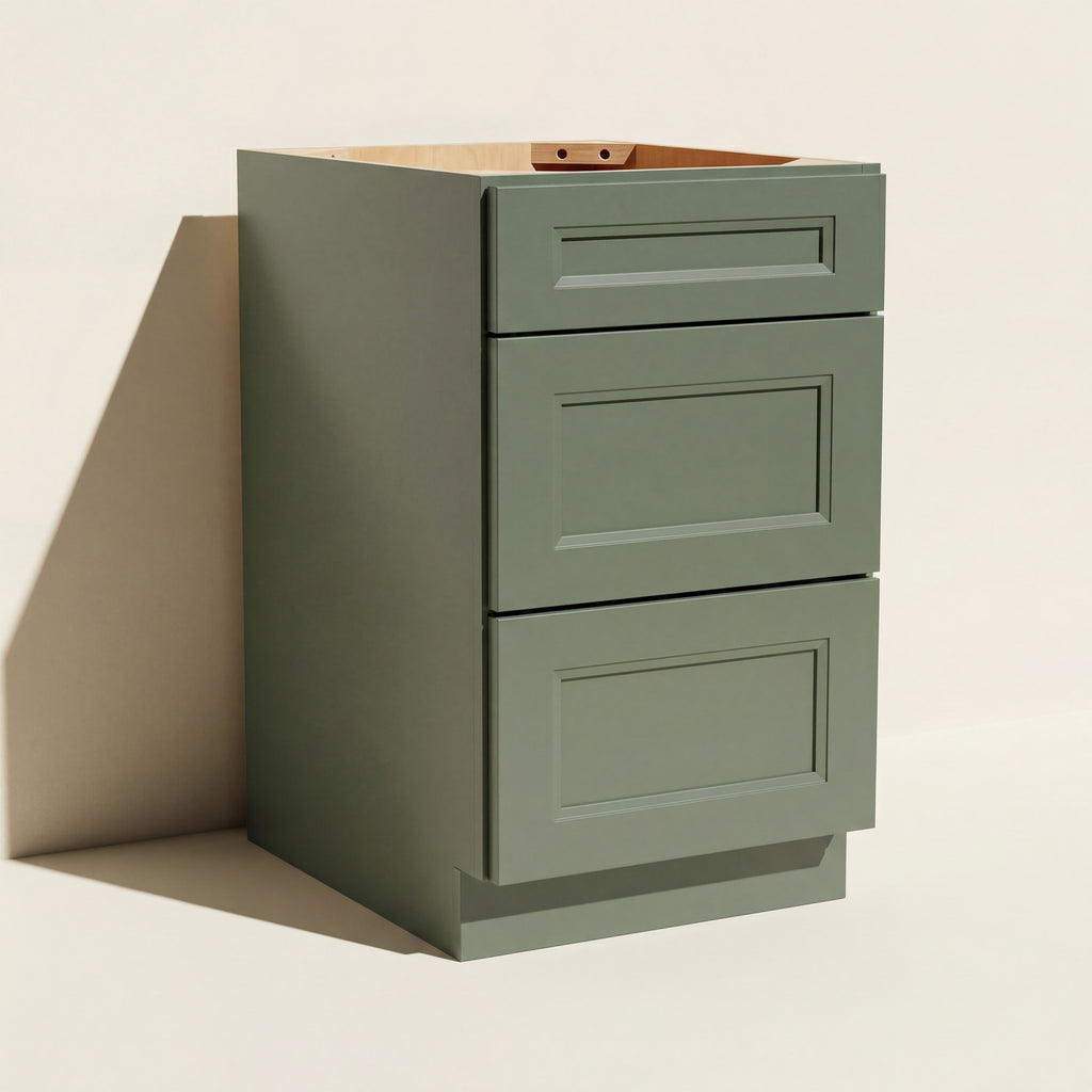 Angled view of a green 18w Belmont beveled mid-width Shaker 3-drawer base cabinet.