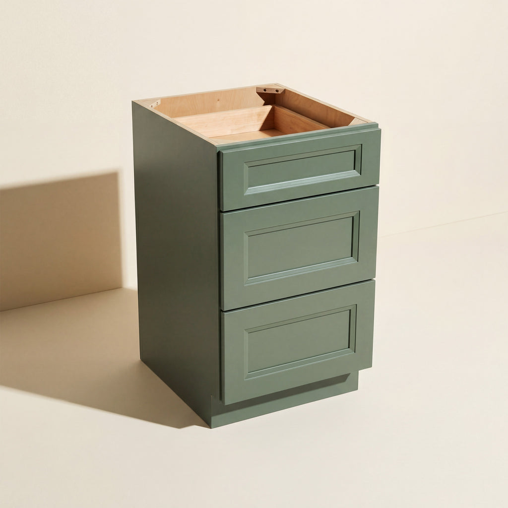Angled view of an assembled green Belmont beveled Shaker 3-drawer base cabinet.