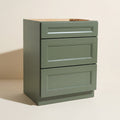 Angled view of a green 24w Belmont Shaker 3-drawer base cabinet.
