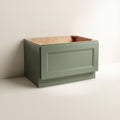 Angled view of a green Belmont beveled Shaker bench seat base cabinet with 1 functional drawer.