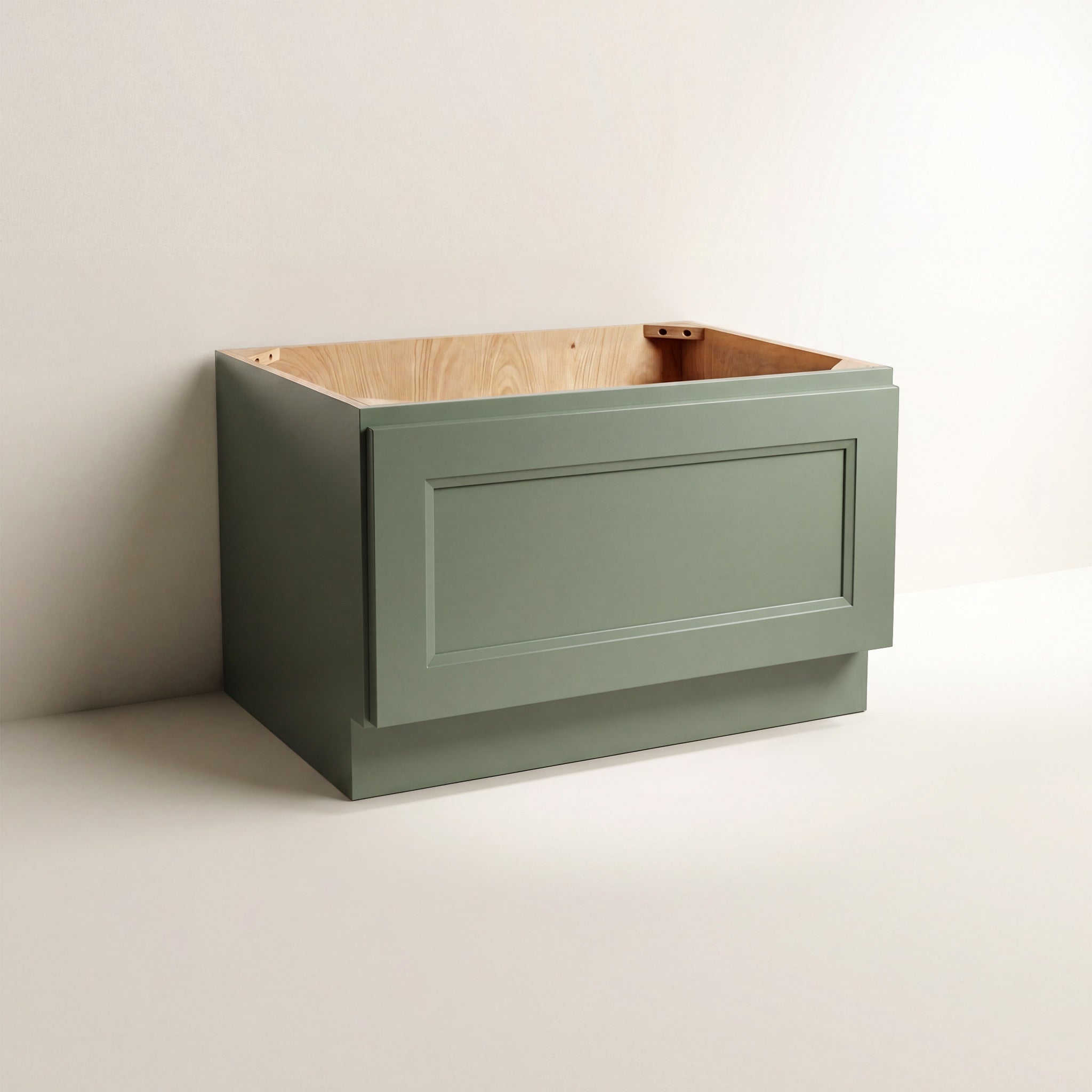 Angled view of a green Belmont beveled Shaker bench seat base cabinet with 1 functional drawer.