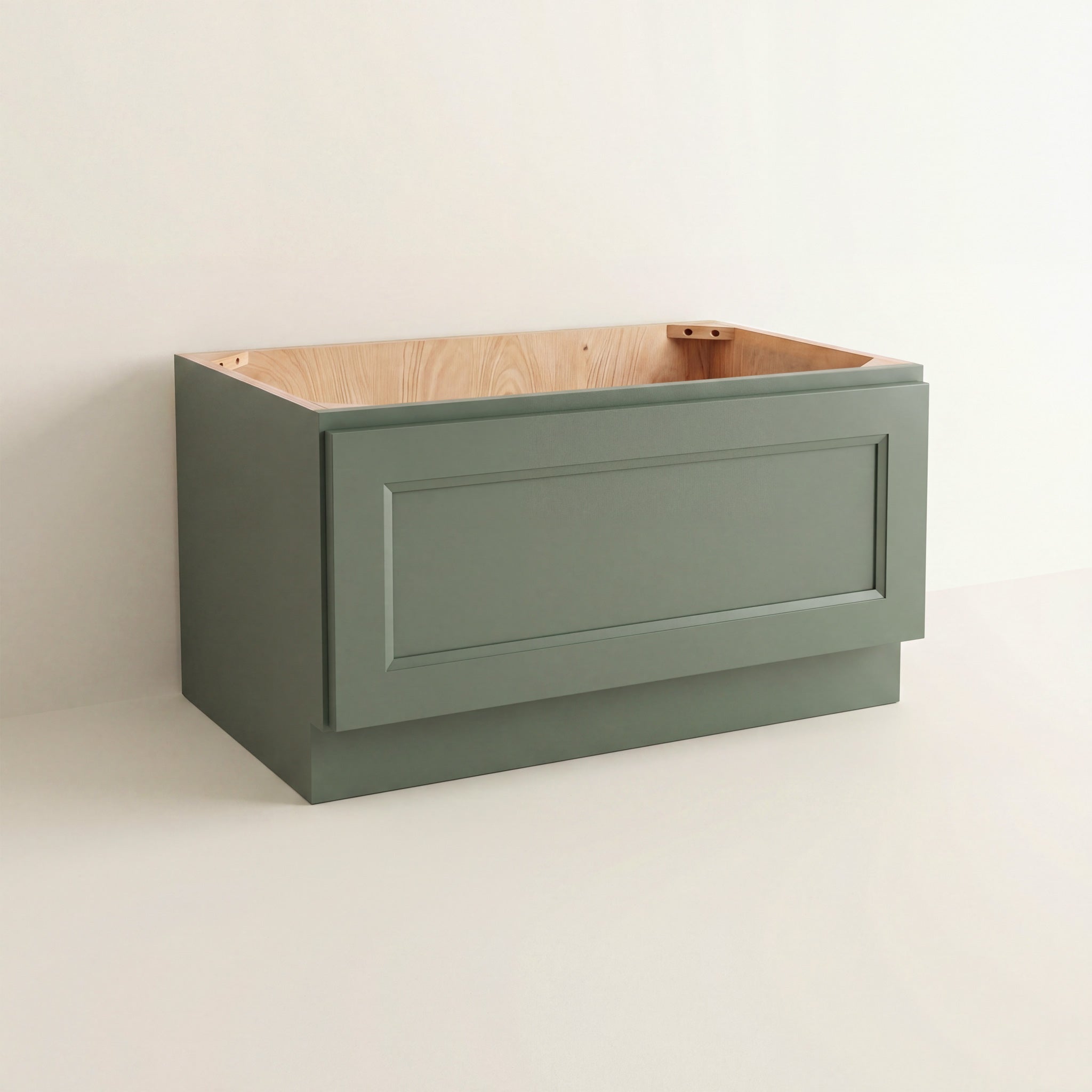 Angled view of a green Belmont Shaker bench seat base cabinet with 1 functional drawer.