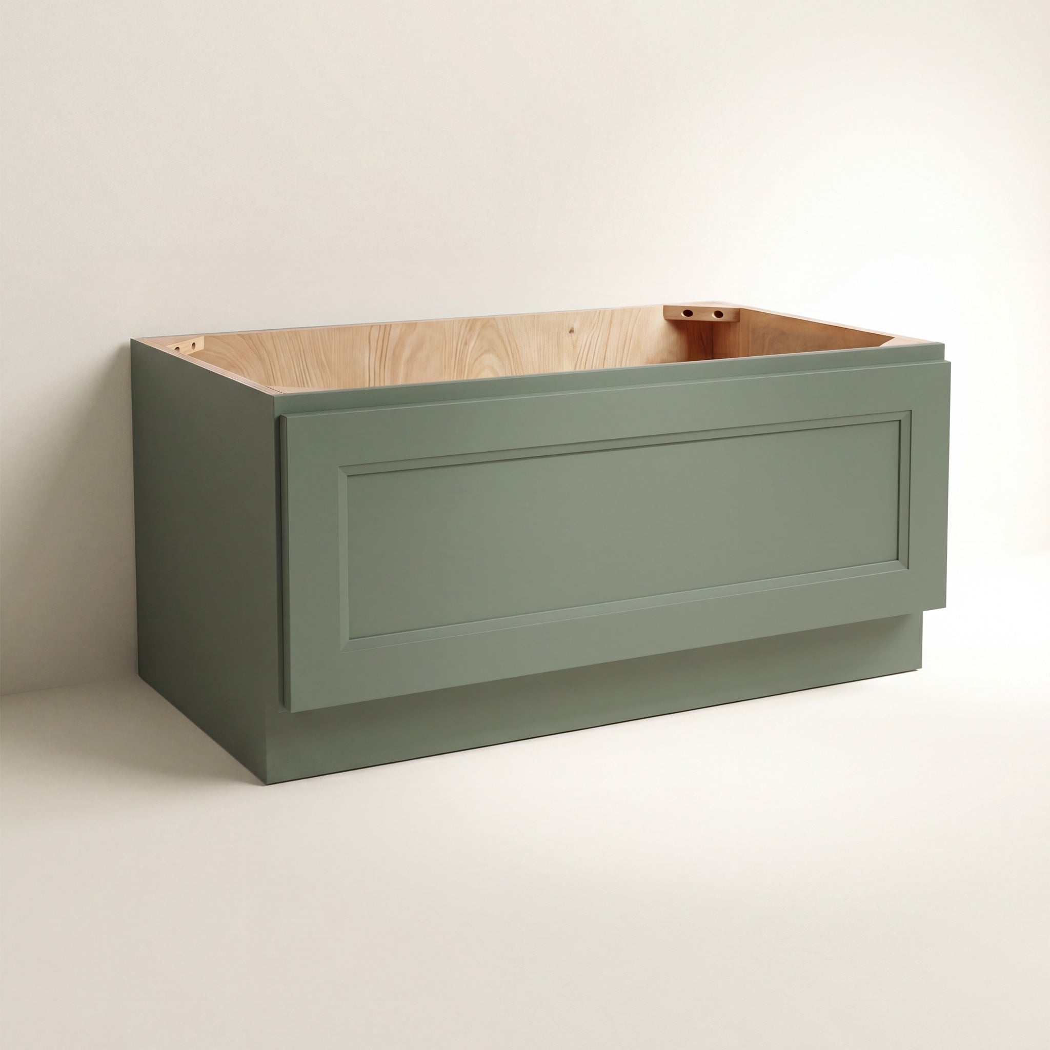 Angled view of a green Belmont beveled Shaker bench seat base cabinet with 1 drawer.