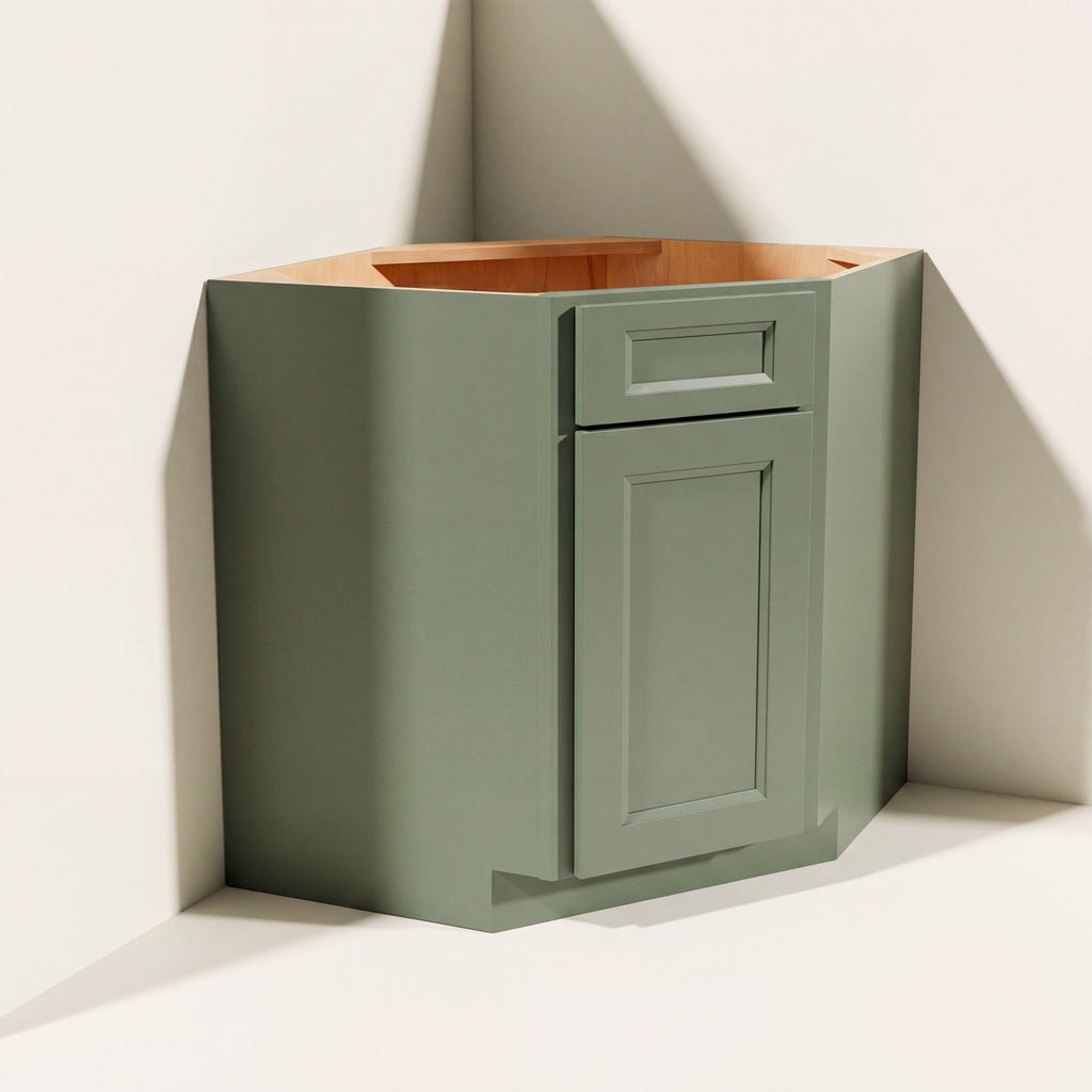 Angled view of a green Belmont beveled Shaker diagonal corner sink base cabinet with 1 door and 1 false drawer.