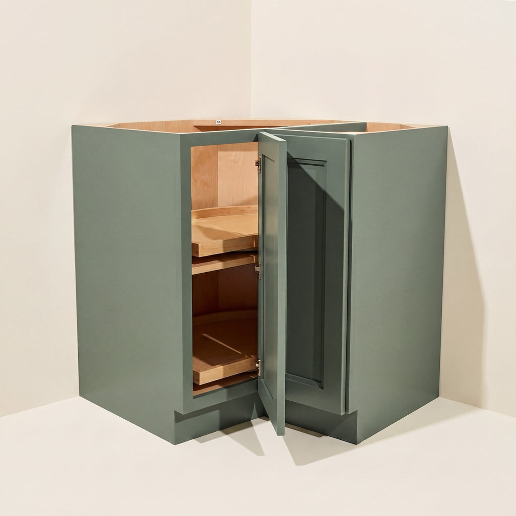 Angled view of a green Belmont beveled Shaker lazy Susan corner base cabinet with 1 bi-fold door.