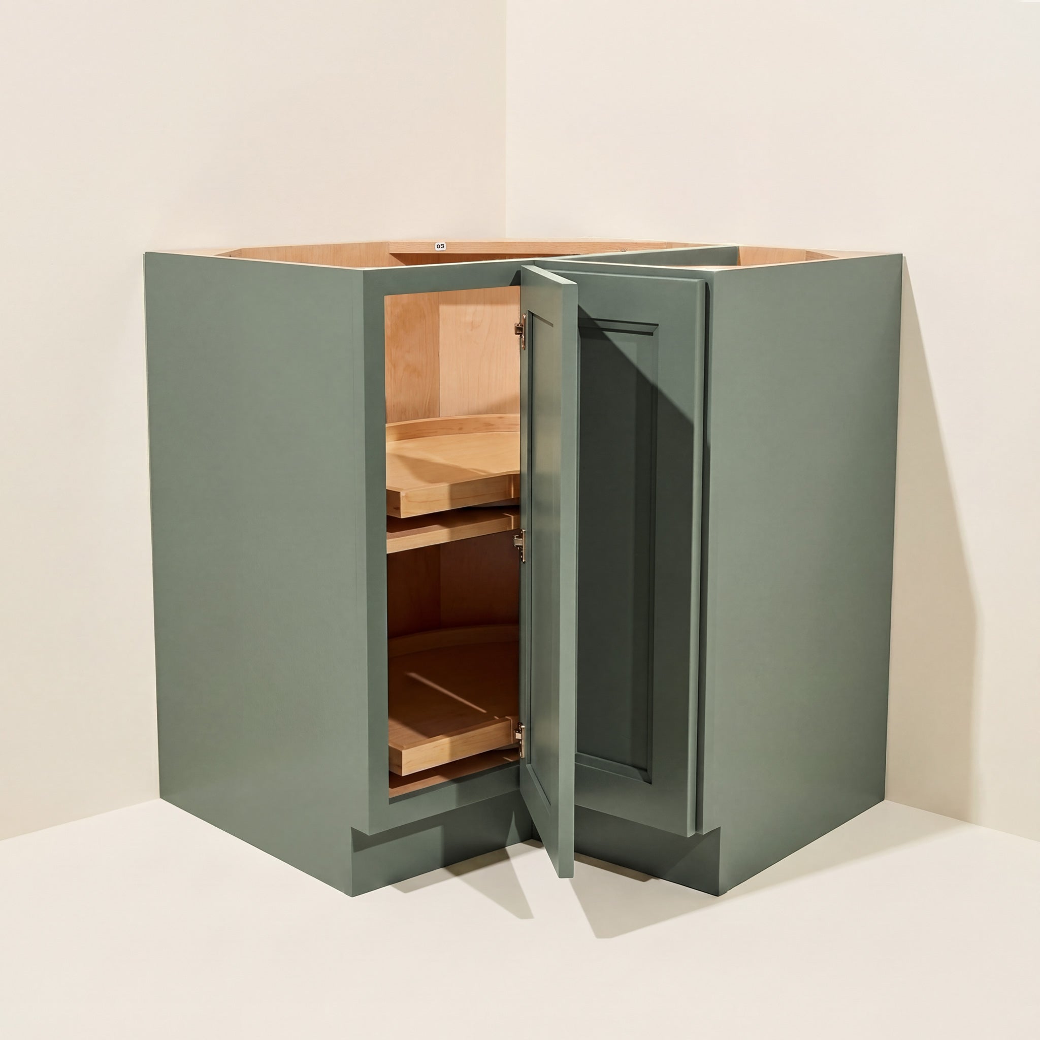 Angled view of a green Belmont beveled Shaker lazy Susan corner base cabinet with 1 bi-fold door.