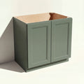 Angled view of a green 33w Belmont beveled Shaker sink base cabinet with 2 doors and 1 false drawer.