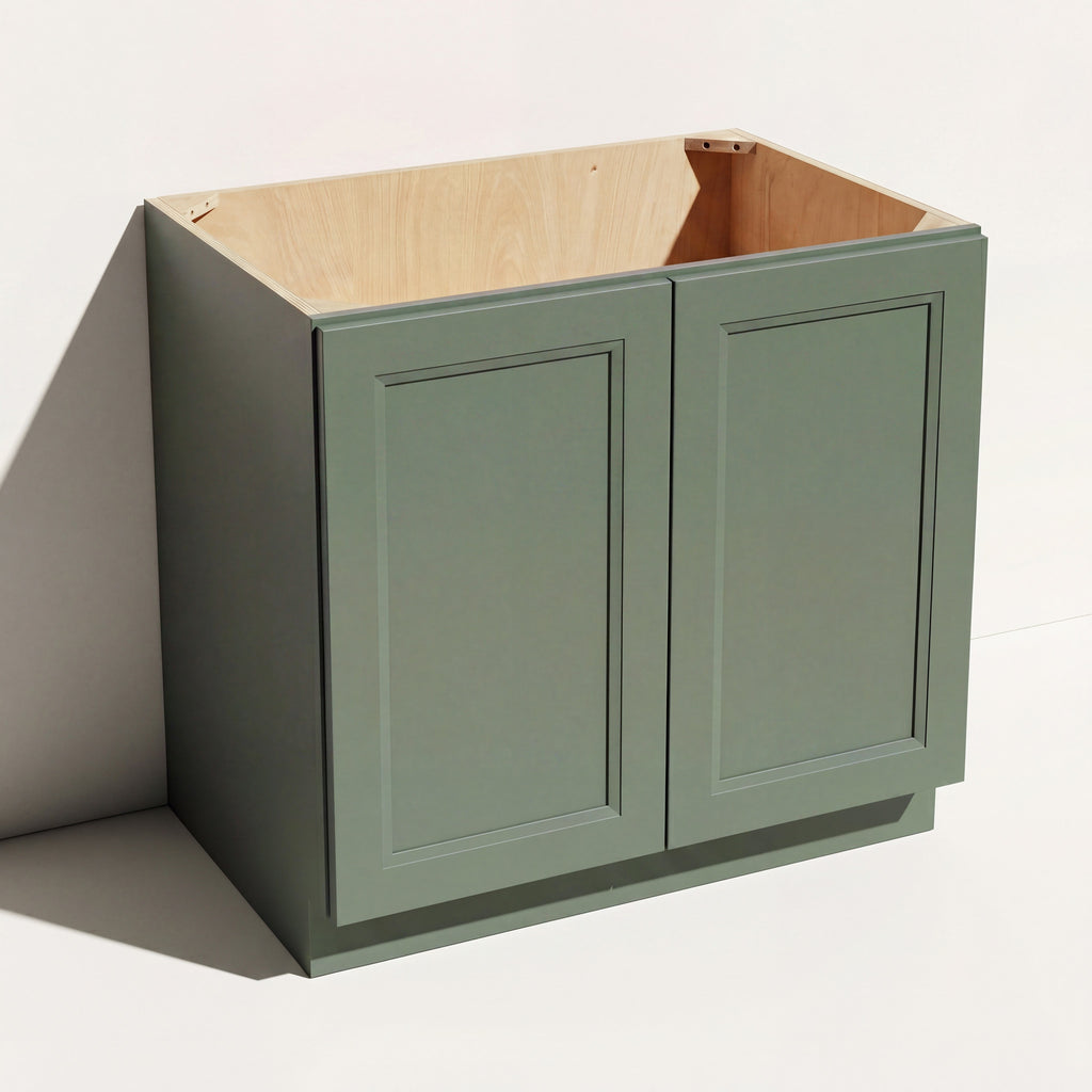 Angled view of a green 36w Belmont beveled Shaker sink base cabinet with 2 doors and 1 false drawer.