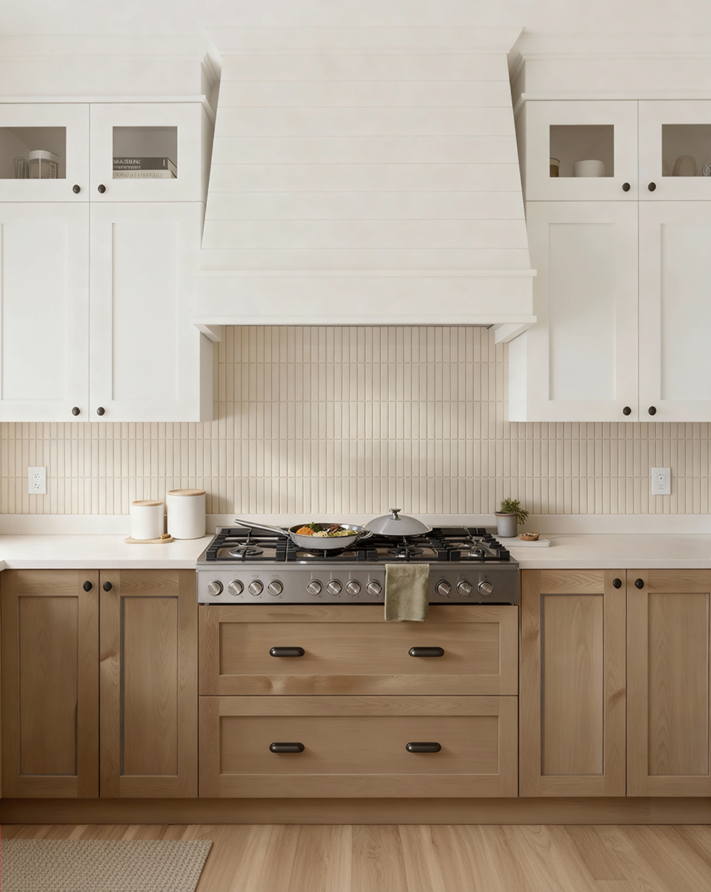 Modern kitchen with white cabinets, beige tiled backsplash, and stainless steel stove.