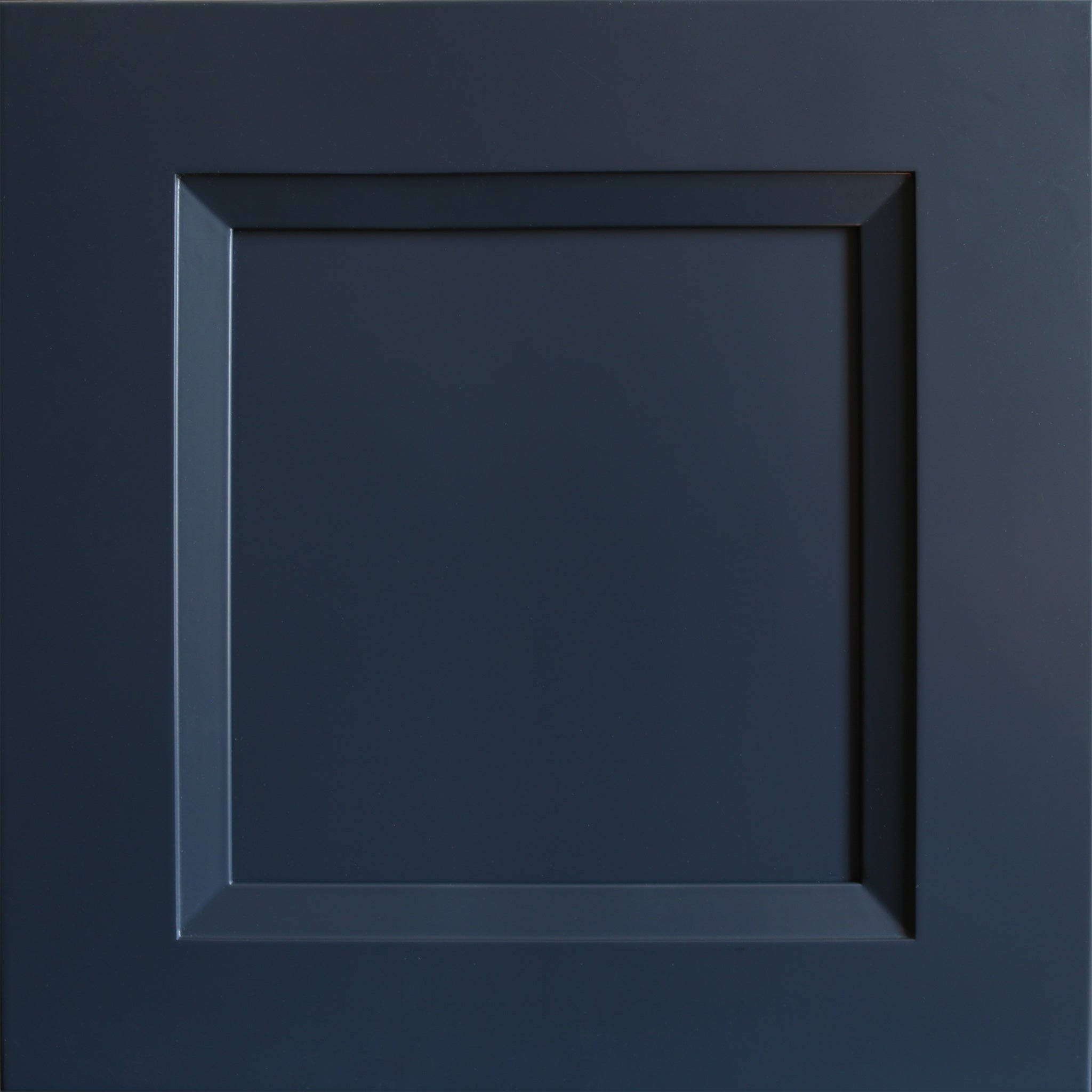 Close up view of a dark blue Belmont shaker cabinet door with a beveled edge that transitions to a recessed panel.