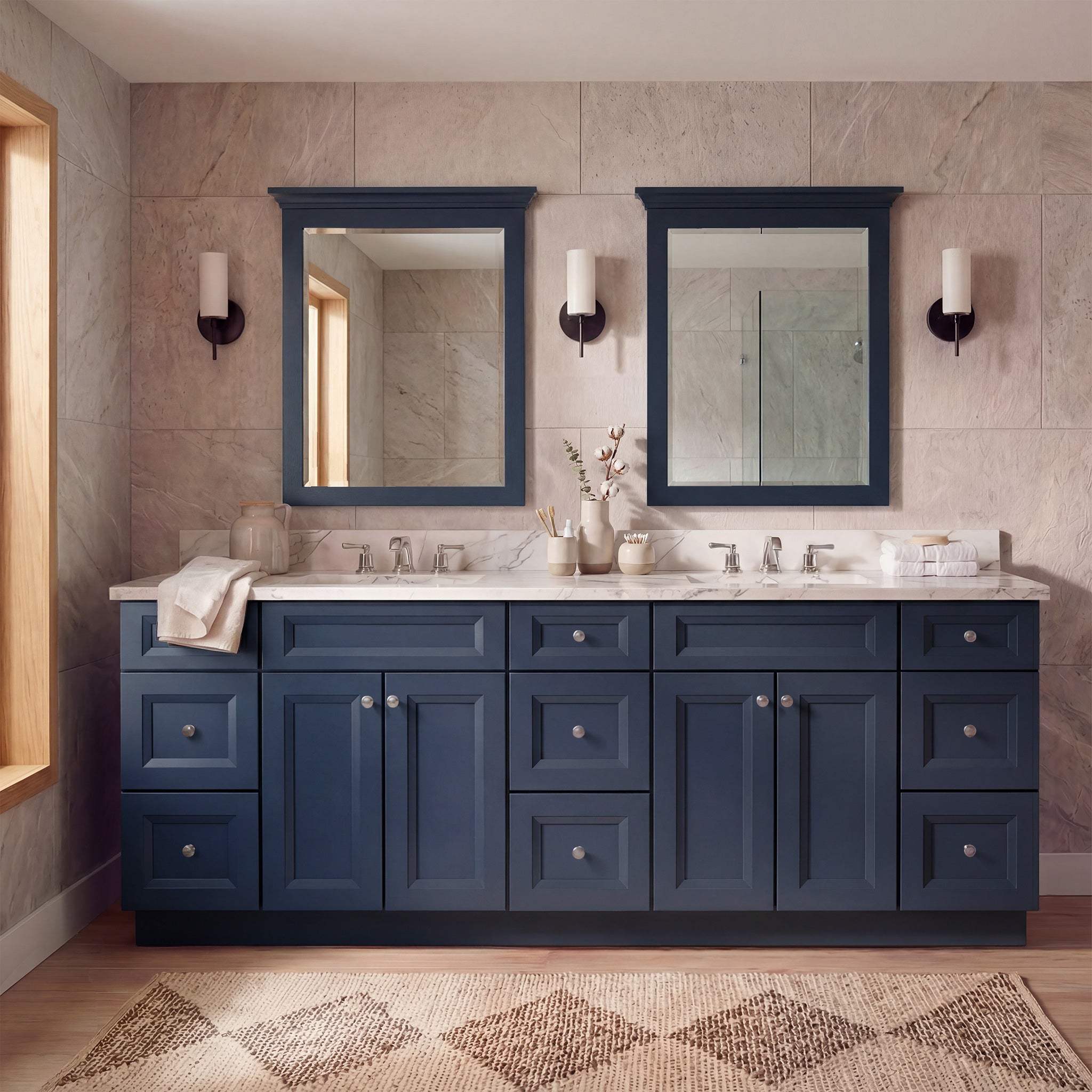Straight-on view of a blue Belmont double sink vanity flanked by two 3-drawer end cabinets in a warm contemporary bathroom.