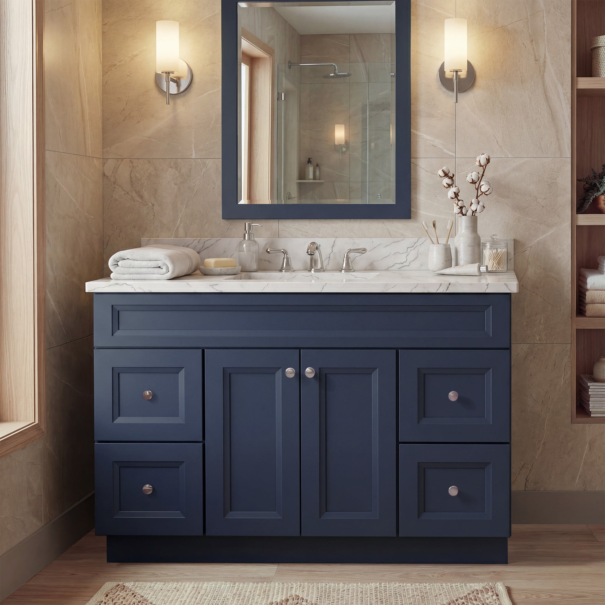 Front view of a blue Belmont shaker vanity with 2 doors, 4 drawers, and 1 false drawer front in a warm contemporary bathroom.