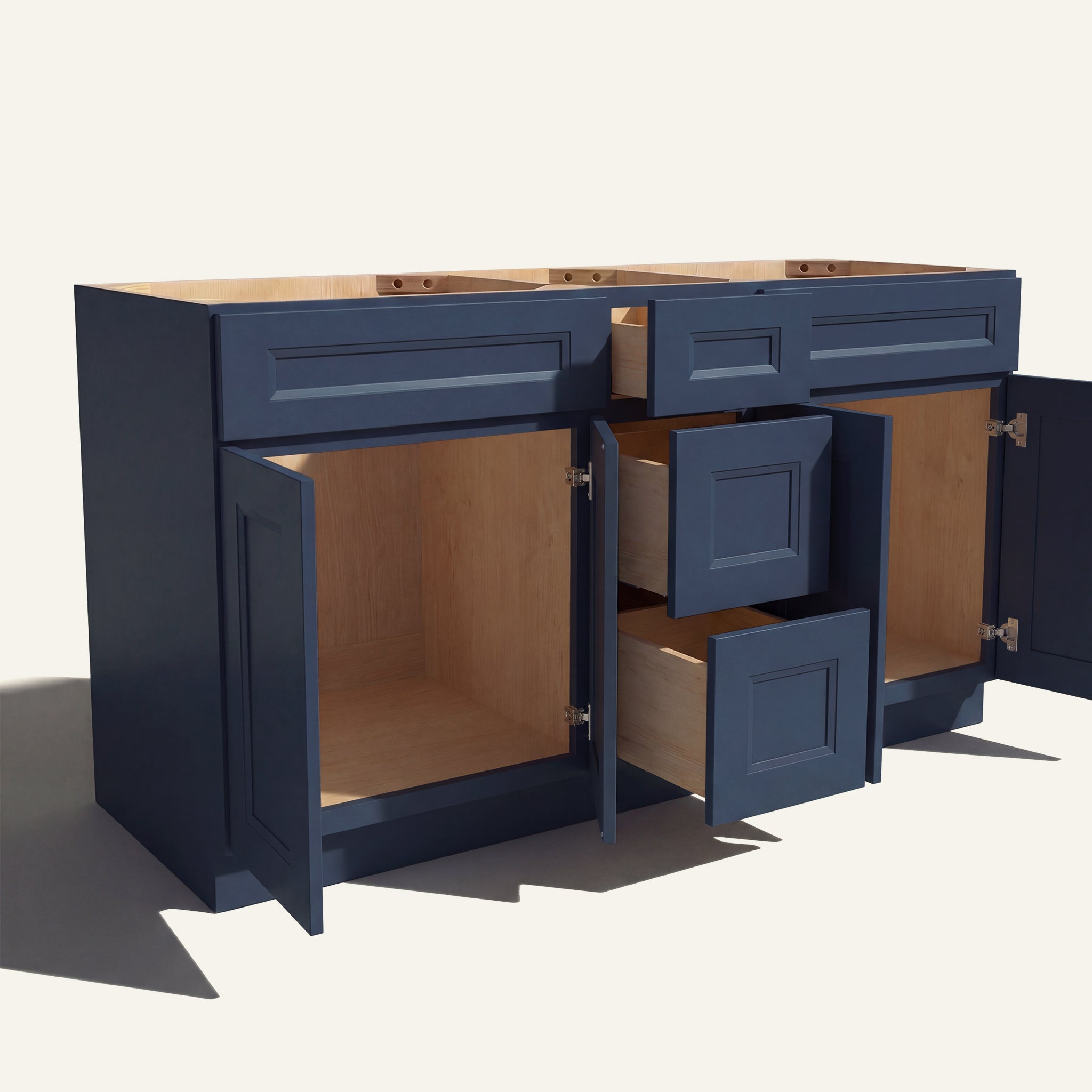 Angled view of a blue Belmont beveled Shaker double sink vanity base with doors and 3 drawers open showing wood interior.