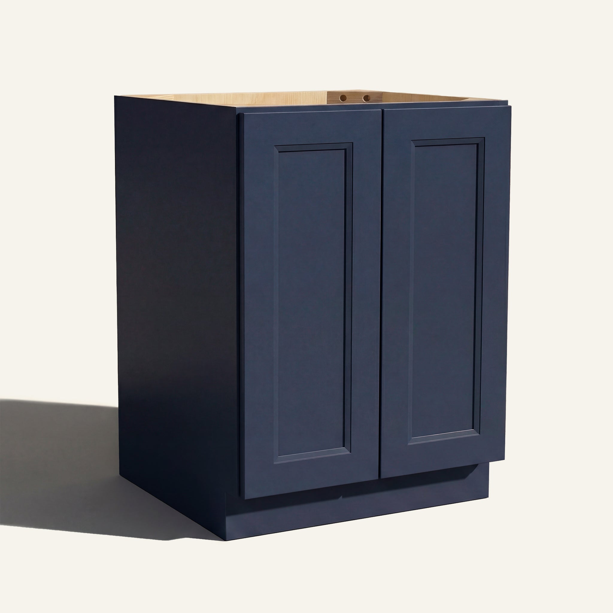 Angled view of a blue Belmont beveled Shaker base cabinet with 2 full height doors.