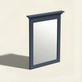 Rectangular mirror with a blue frame on a beige background.