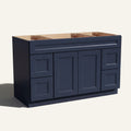 Angled view of a blue Belmont beveled Shaker wide single sink vanity base with 2 doors, 4 drawers, and 1 false drawer front.