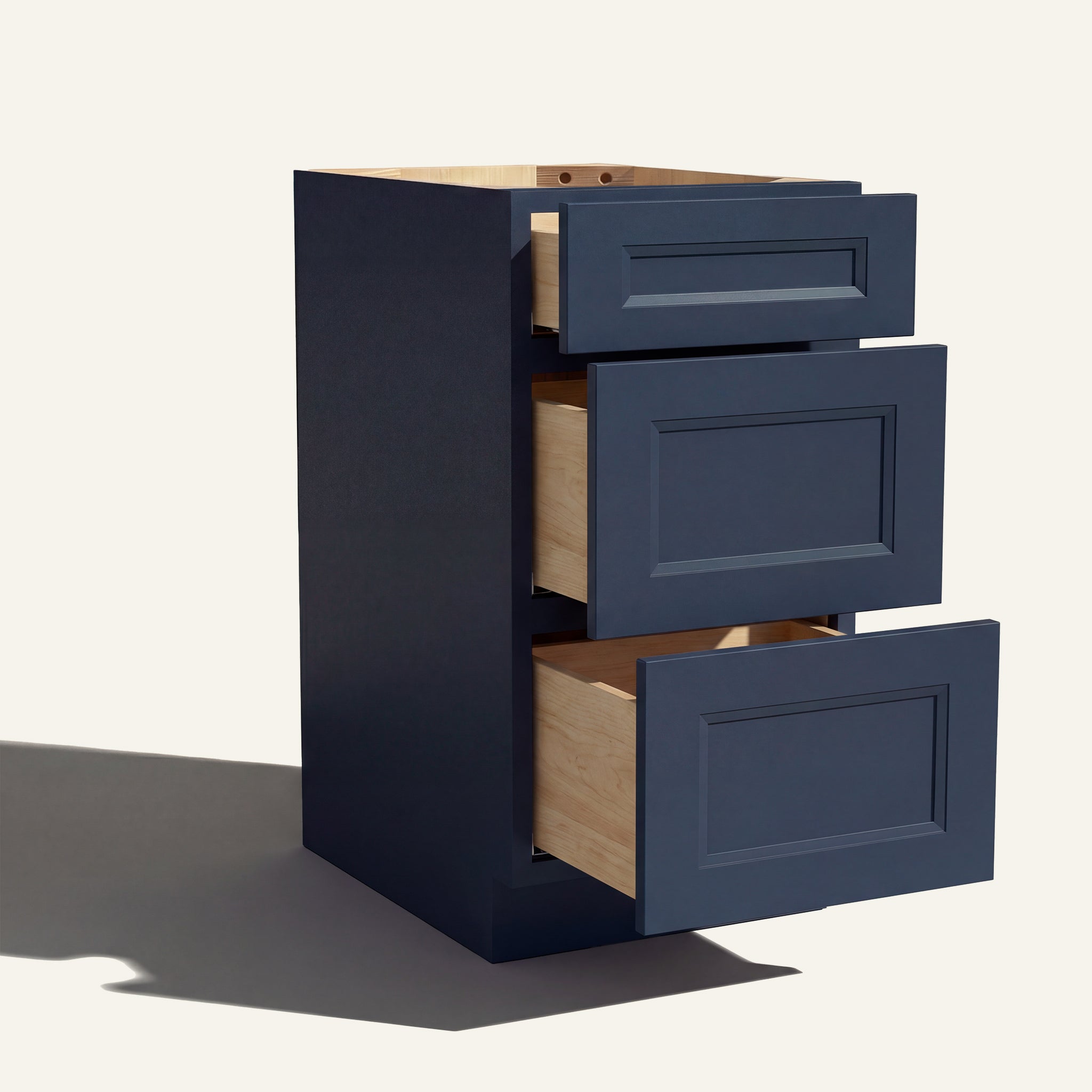 Angled view of a blue Belmont beveled Shaker 3-drawer vanity base cabinet with drawers open showing solid wood drawer boxes.