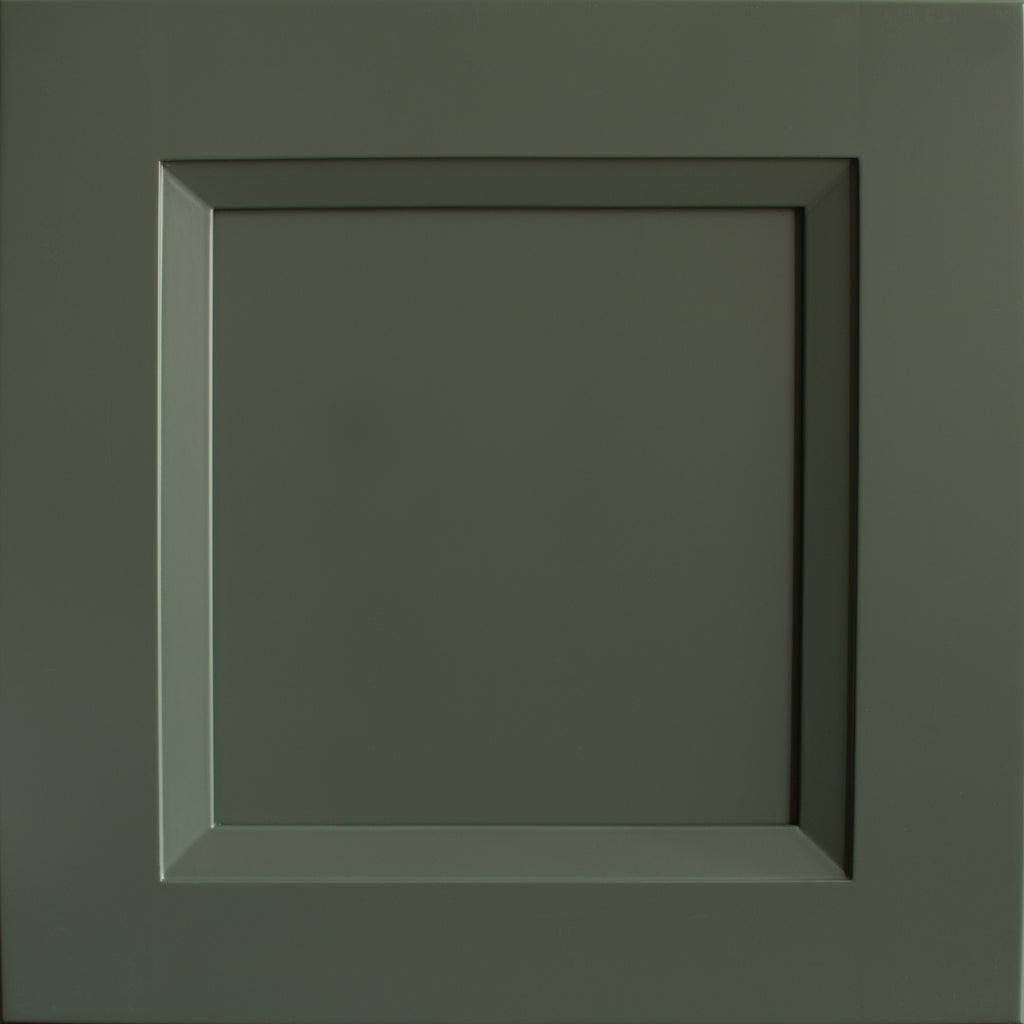 Close up view of a Belmont shaker green cabinet door with a beveled edge that transitions to a recessed panel.