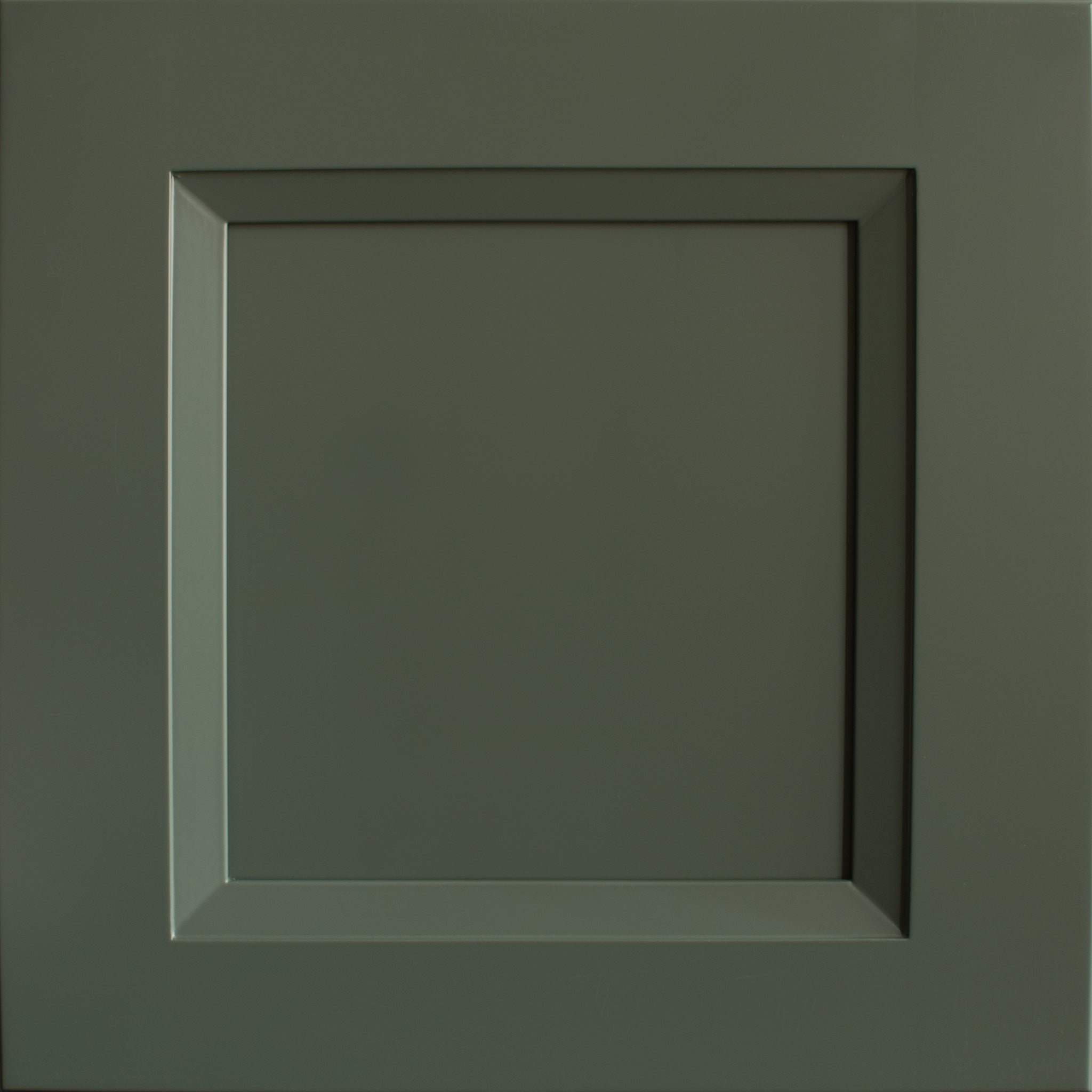 Close up view of a Belmont shaker green cabinet door with a beveled edge that transitions to a recessed panel.