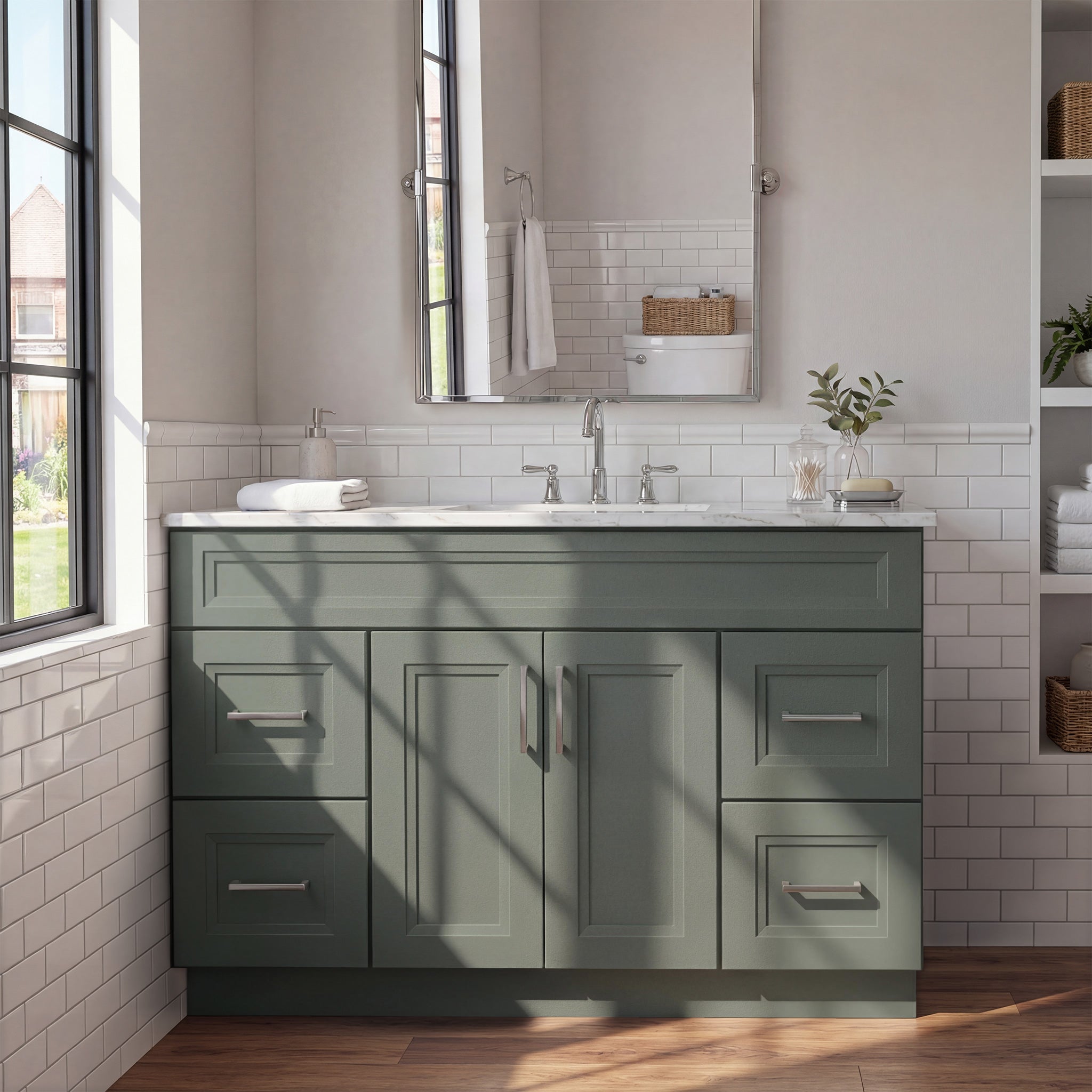 Front view of a green Belmont shaker vanity with 2 doors, 4 drawers, and 1 false drawer front in a warm contemporary bathroom.