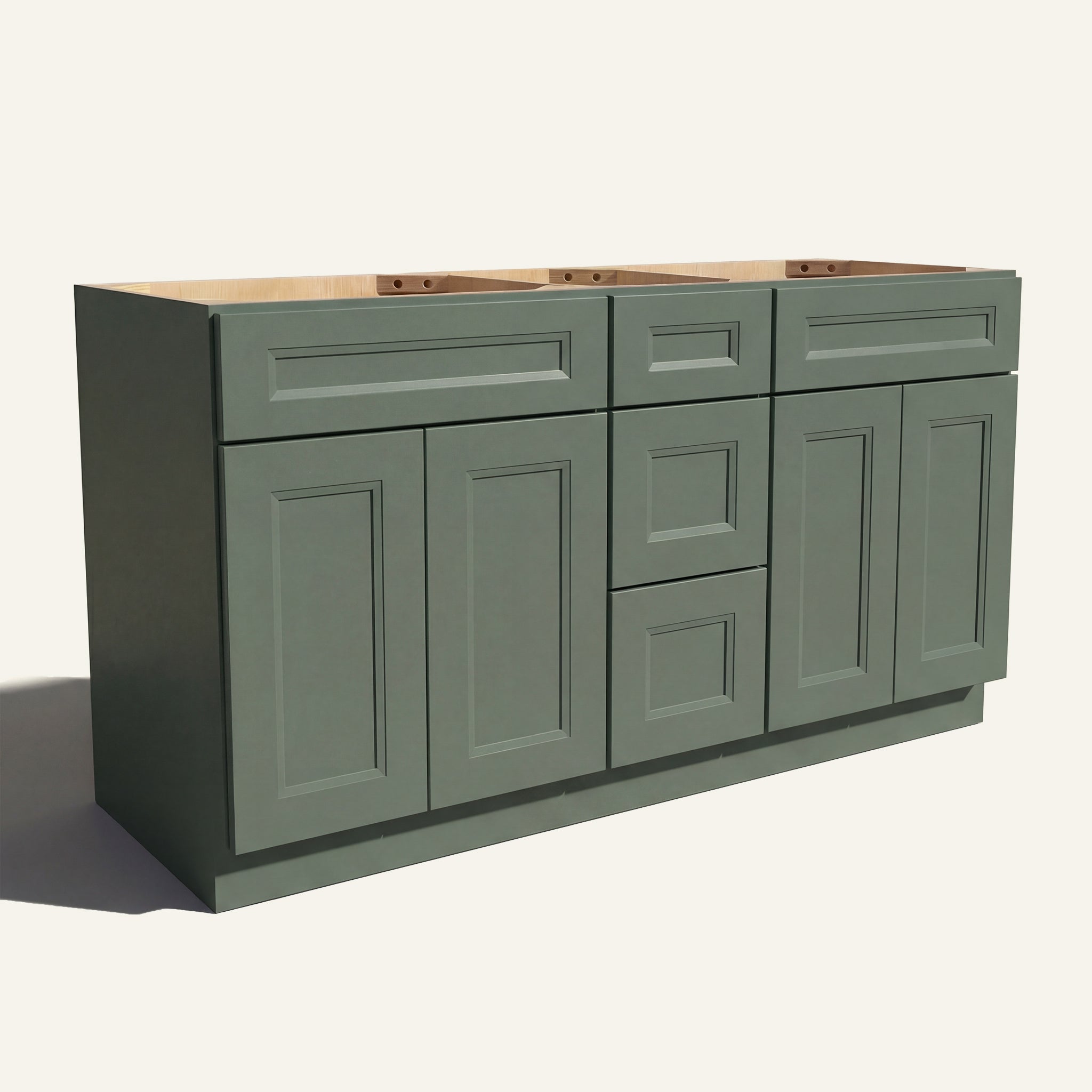 Angled view of a green Belmont beveled Shaker double sink vanity base with 4 doors, 3 drawers, and 2 false drawer fronts.