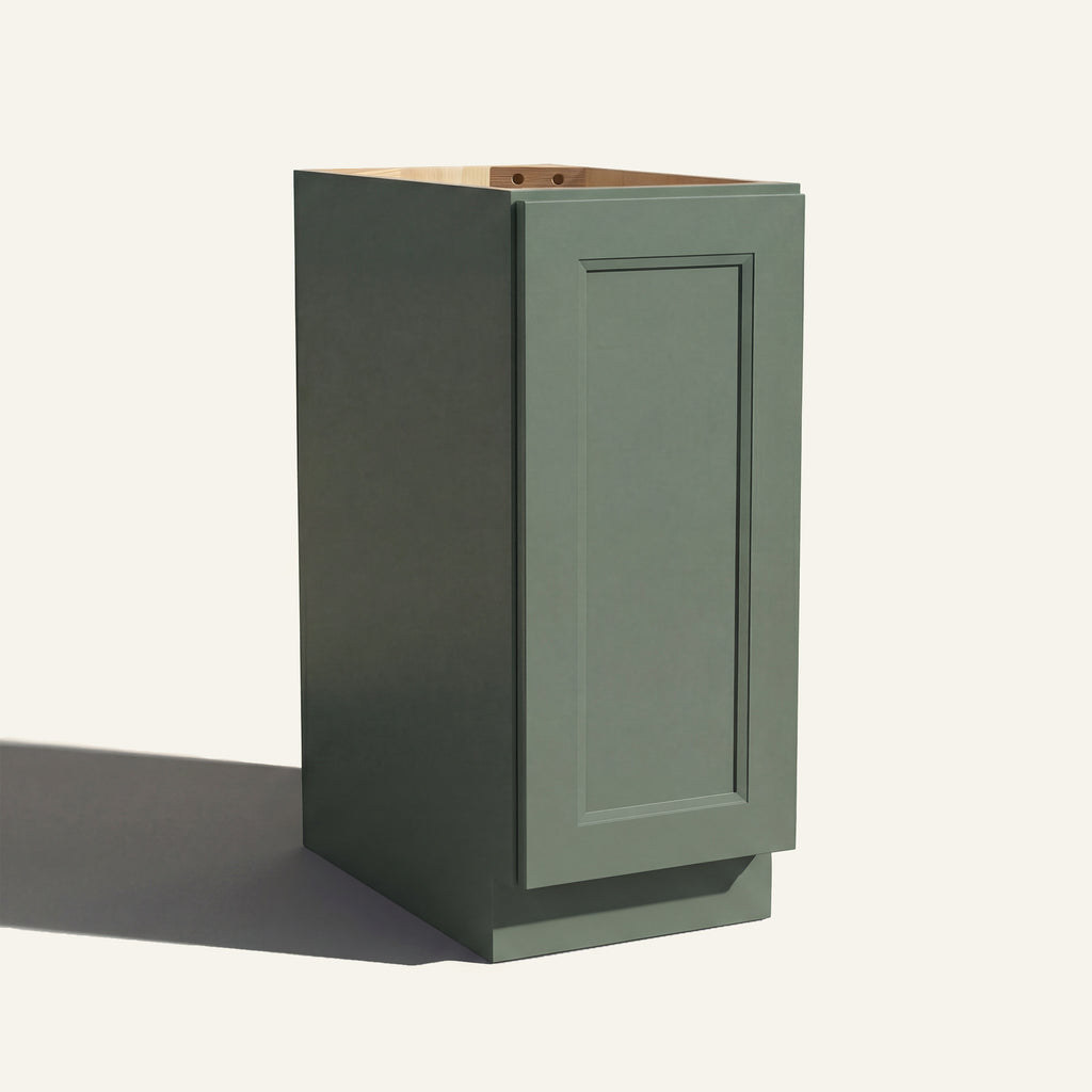 Angled view of a green Belmont beveled Shaker base cabinet with 1 full-height door.