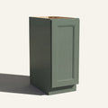 Angled view of a green Belmont beveled Shaker base cabinet with 1 full-height door.