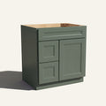 Angled view of a green Belmont beveled shaker single sink vanity with a right-side door and two left-side drawers.