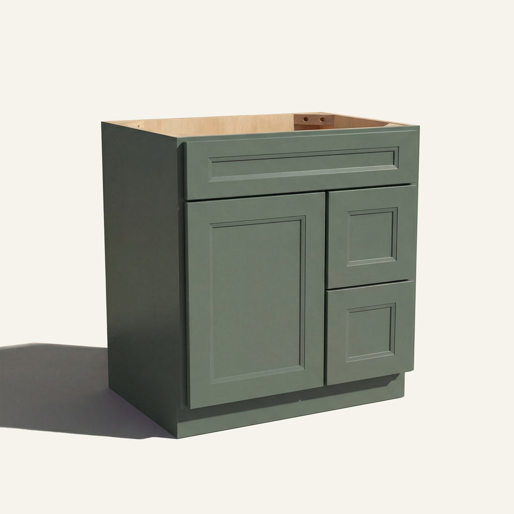 Angled view of a green Belmont beveled shaker single sink vanity with a left-side door and two right-side drawers.