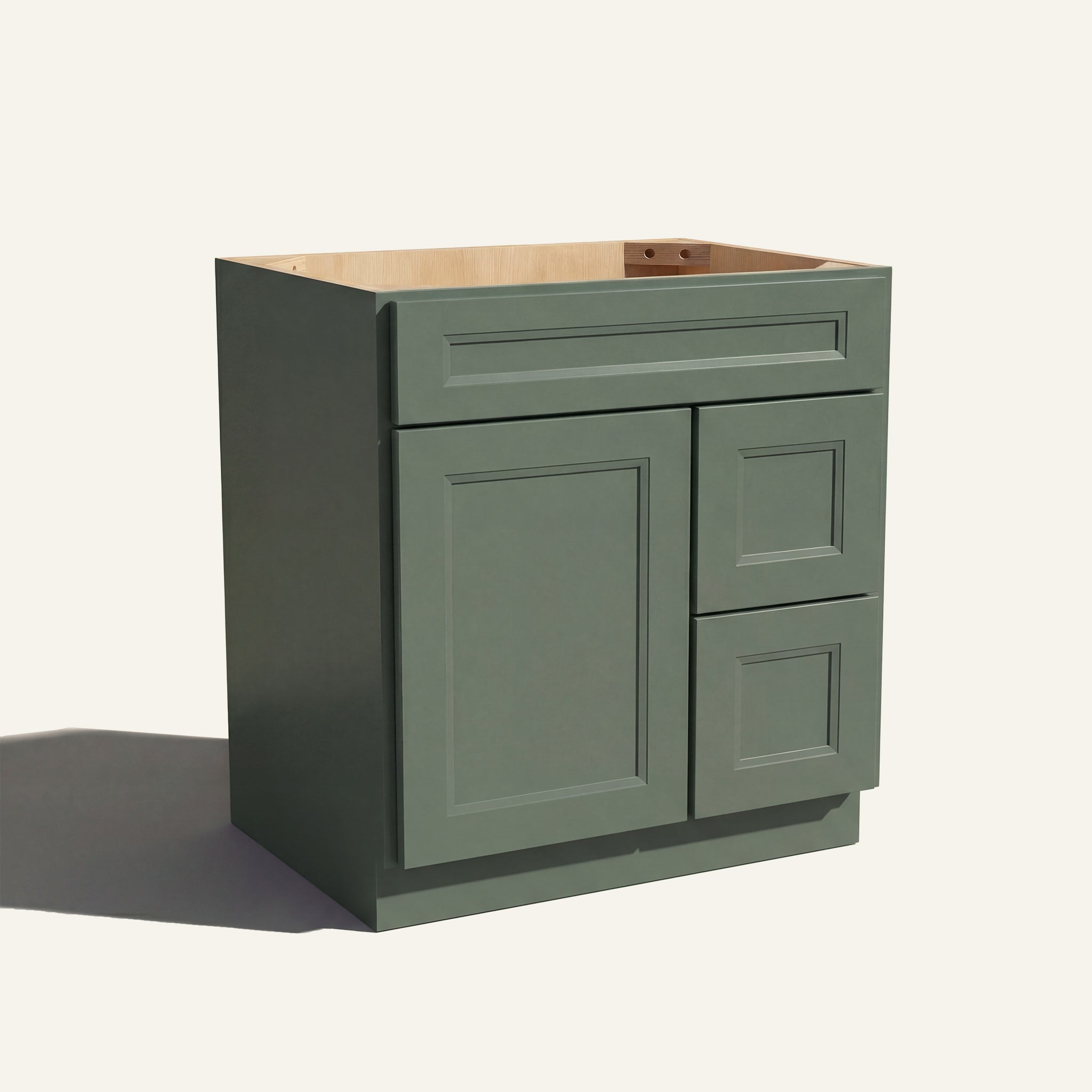 Angled view of a green Belmont beveled shaker single sink vanity with a left-side door and two right-side drawers.