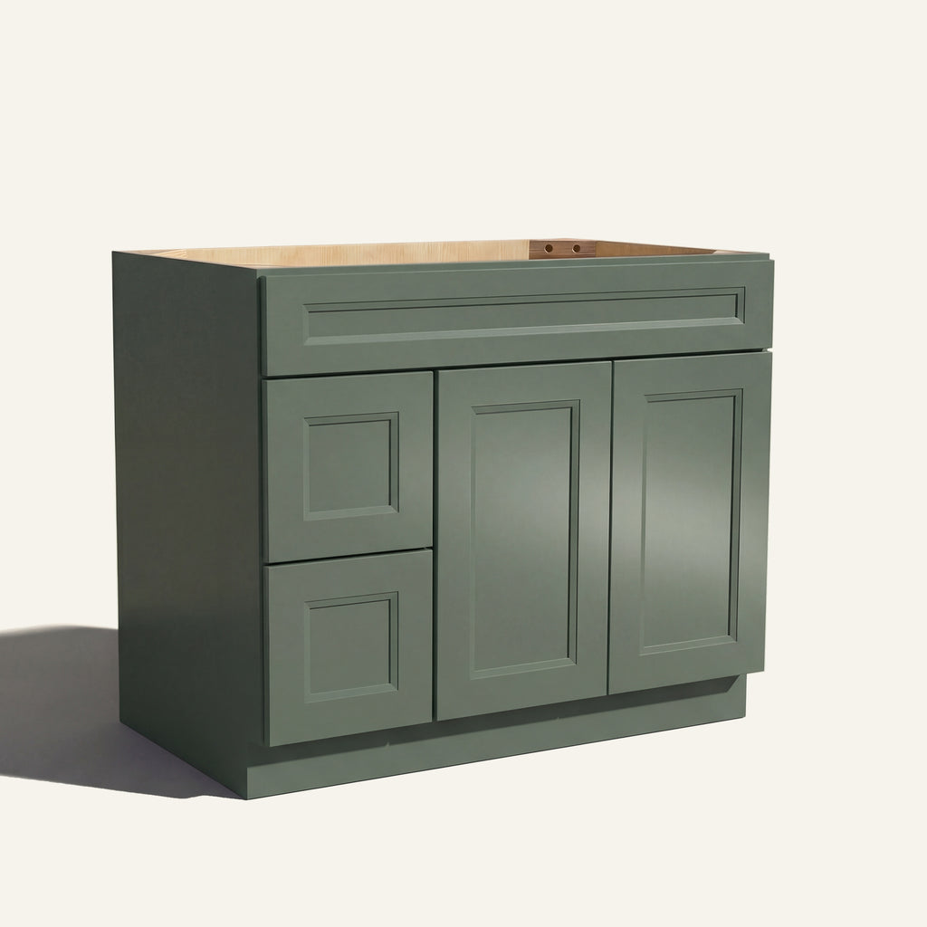 Angled view of a green Belmont beveled shaker single sink vanity featuring two doors and a left-side drawer bank.