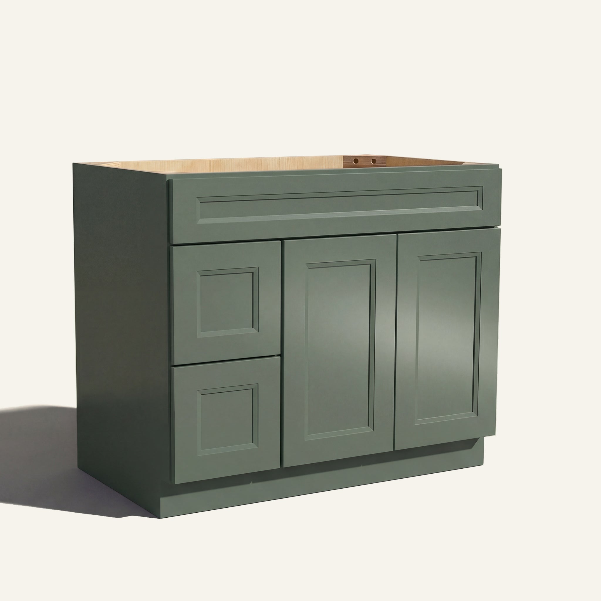 Angled view of a green Belmont beveled shaker single sink vanity featuring two doors and a left-side drawer bank.