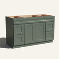 Angled view of a green Belmont beveled Shaker wide single sink vanity base with 2 doors, 4 drawers, and 1 false drawer front.